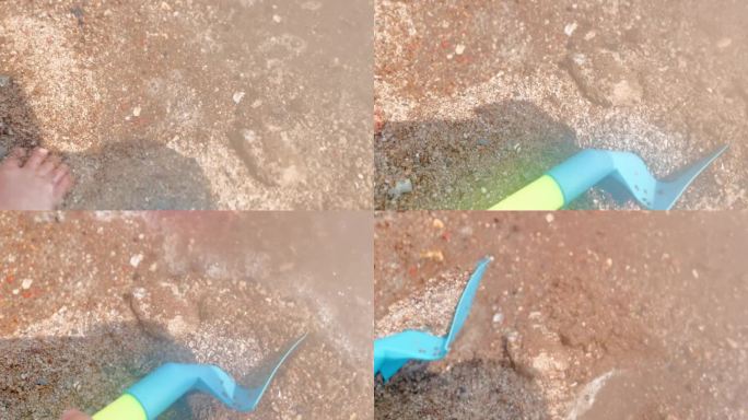 玩水玩泥沙玩耍的孩子铲子特写
