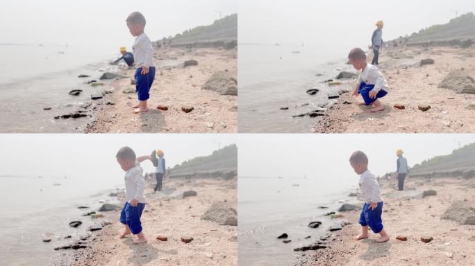 江边玩耍扔石头玩耍小孩