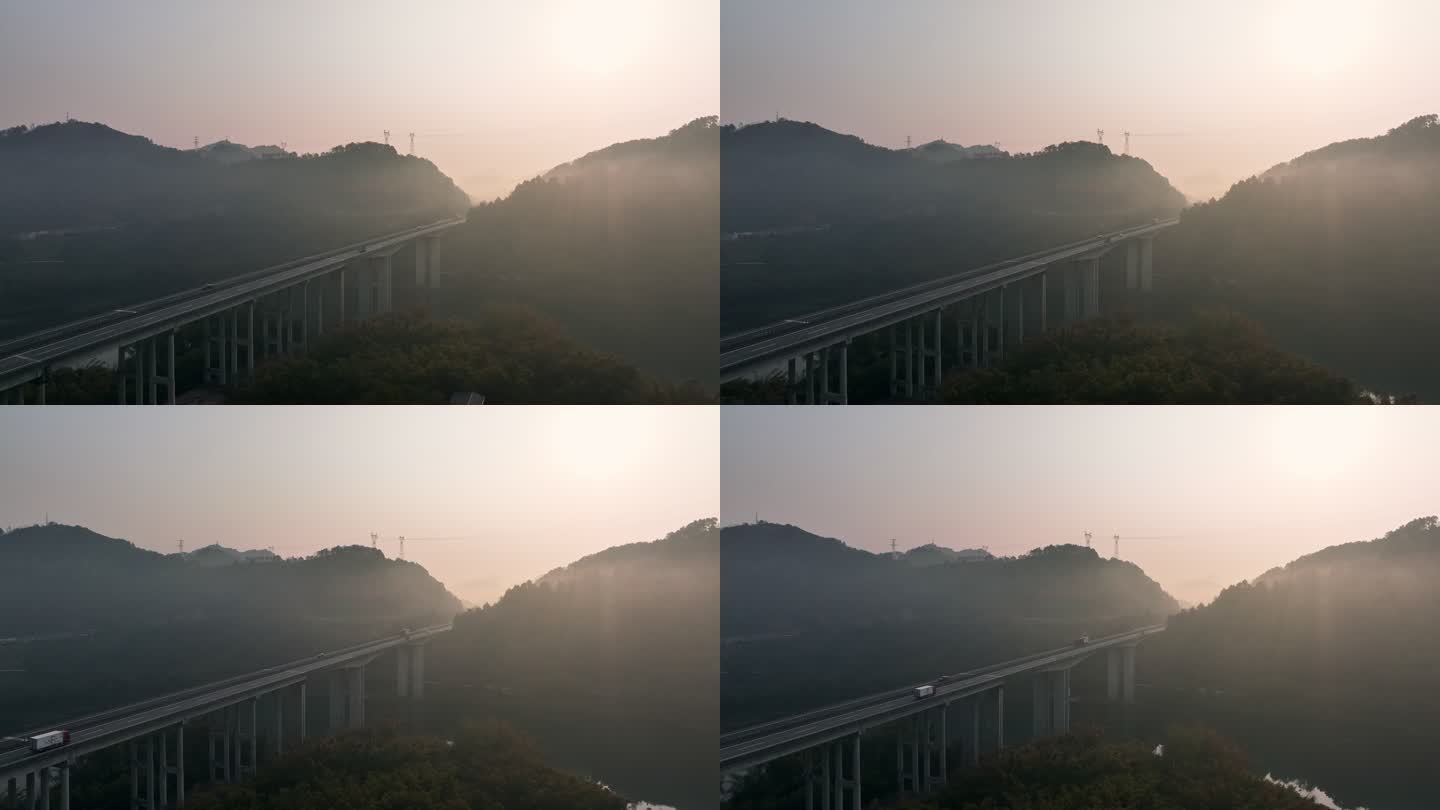 清晨日出下山边漓江上的高速公路大桥的薄雾