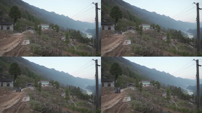 摩托车行驶在江景乡村公路上