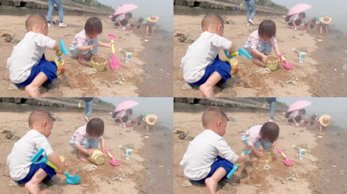 玩水玩泥沙玩耍的孩子