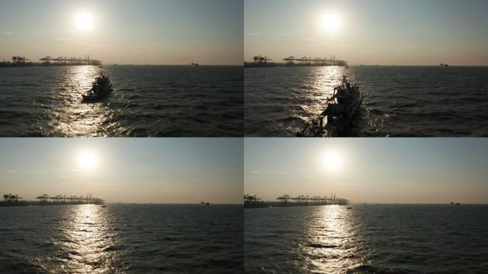 航拍4k夕阳下海面上行驶的船只