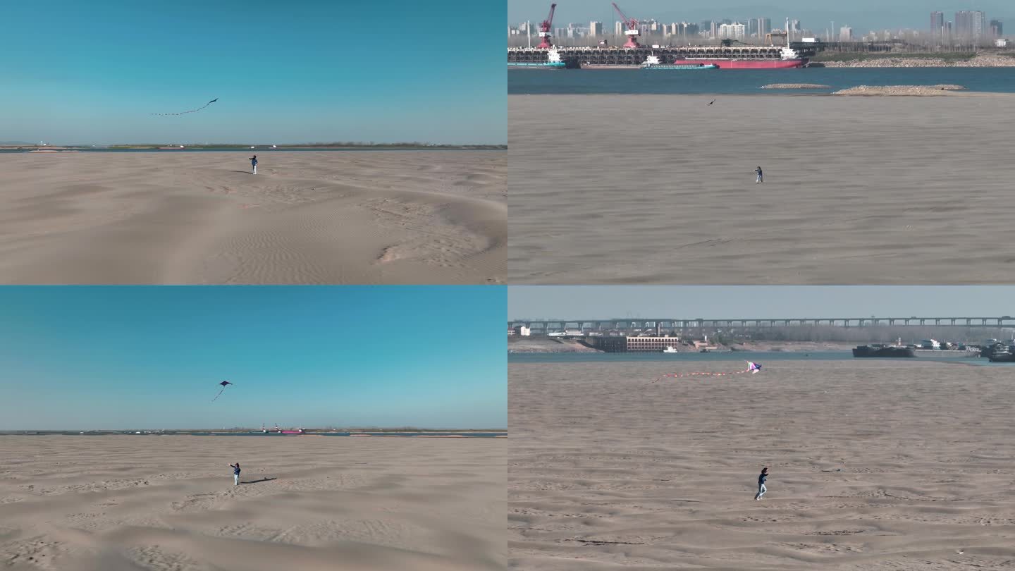 女生在长江边广袤的沙滩上奔跑放风筝航拍