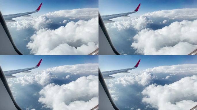 飞机空中窗外云层飞行机翼素材