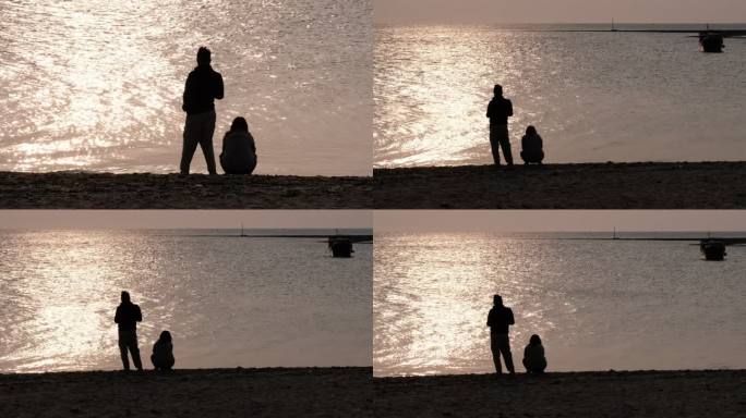 夕阳下的海边情侣