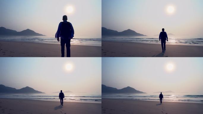 人走在海边上看日出