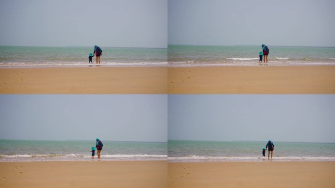 父女在海边游玩沙滩海滩海浪海水浪花希望