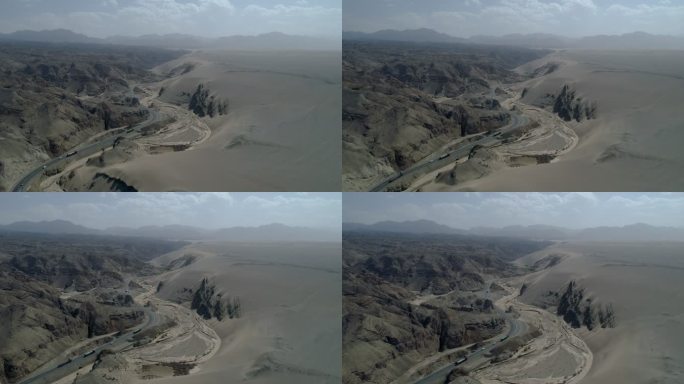 航拍汽车行驶在新疆荒漠沙漠公路