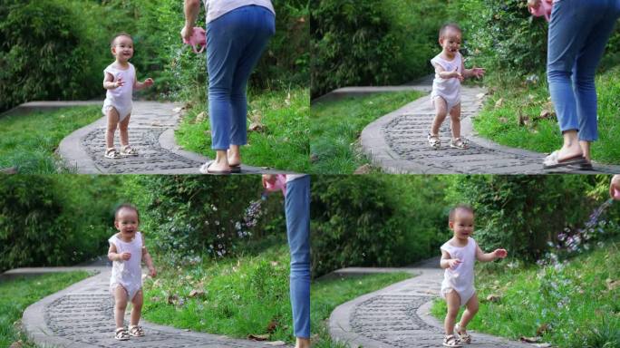 蹒跚学步小婴儿和妈妈户外玩耍泡泡快乐童年