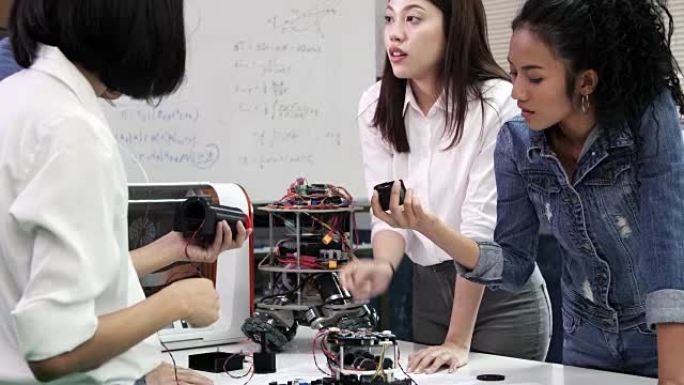 青少年在机器人俱乐部项目中研究功能齐全的可编程机器人。创意设计师在车间测试机器人原型。科学概念