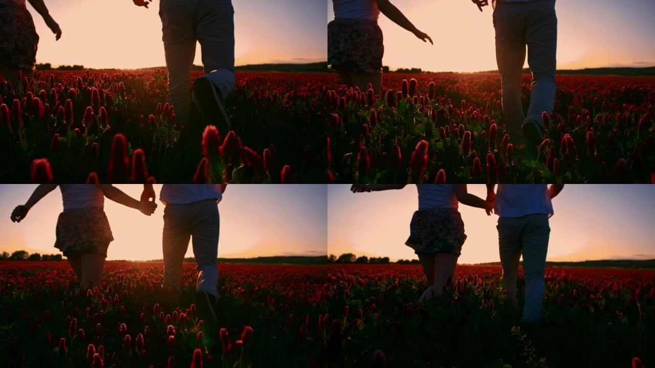 日落时分，一对情侣在田野里跑步