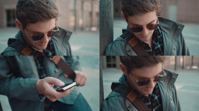 男子在城市环境中检查手机
