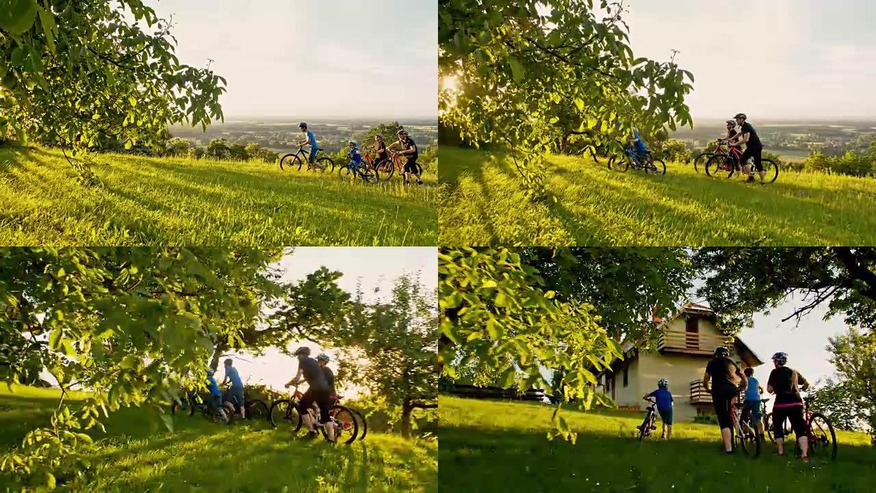 WS骑自行车的家庭到达他们的乡村小屋