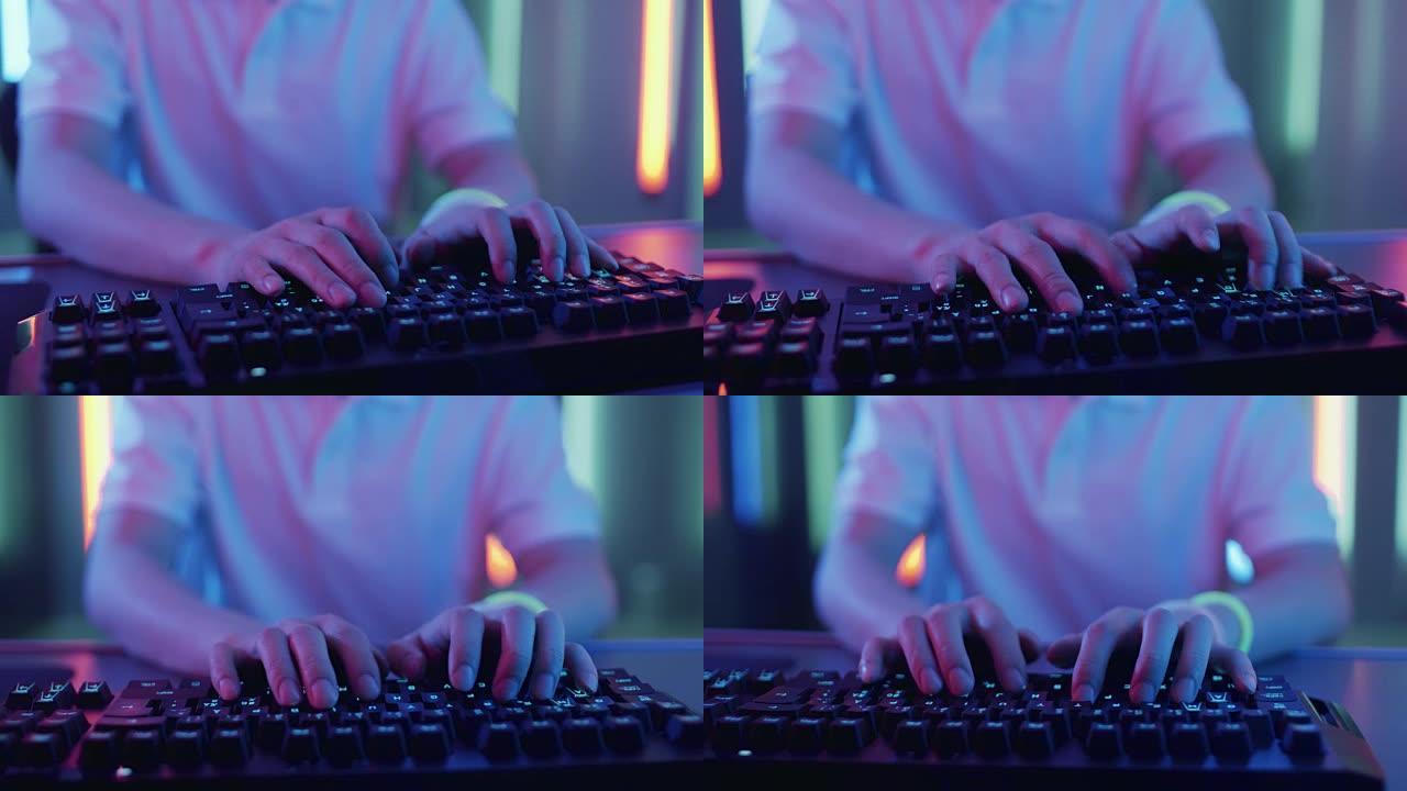 使用键盘在视频游戏中玩游戏的玩家手中的特写镜头。黑客闯入系统。