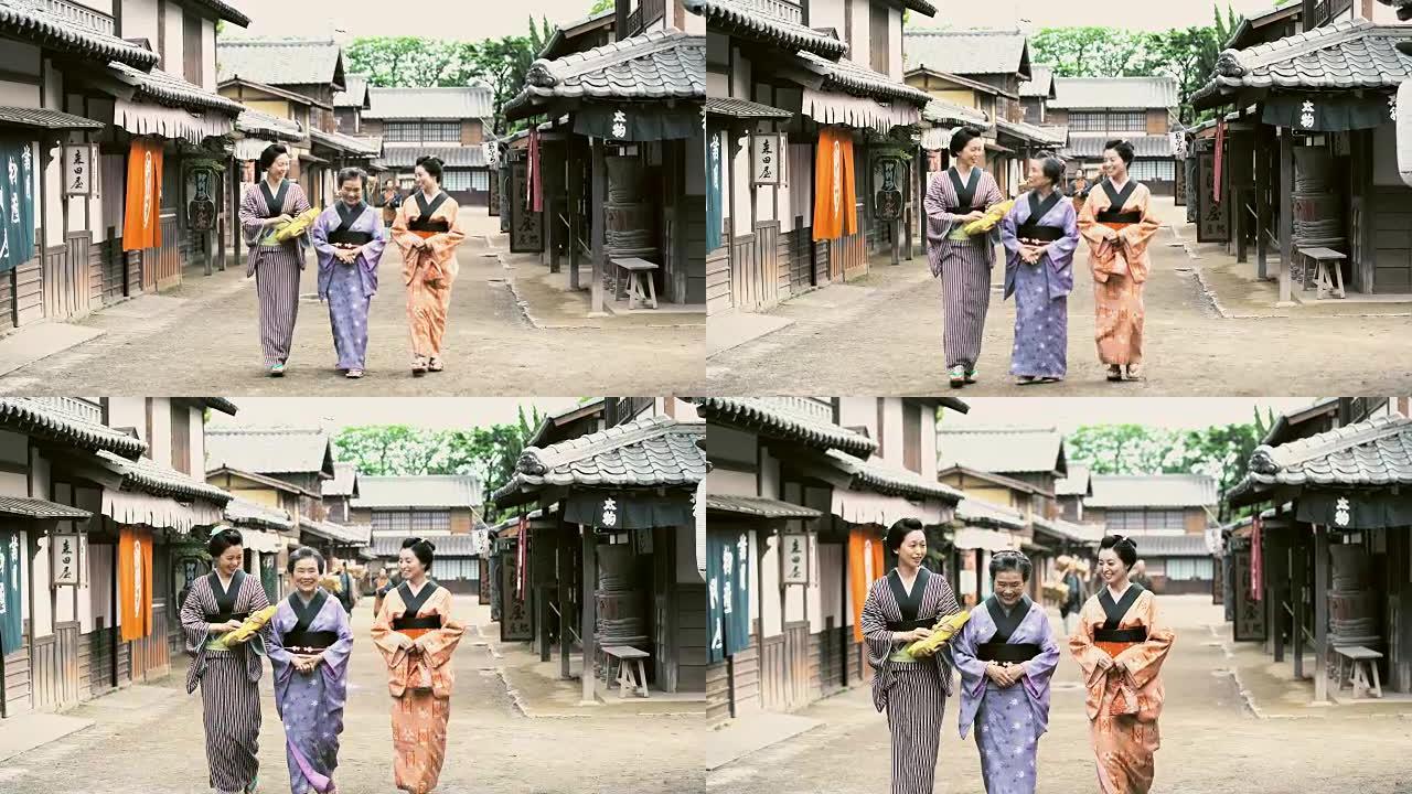 穿着传统服装的DS日本妇女在村子里散步