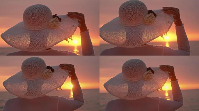 SLO MO时尚女人在海上享受日落