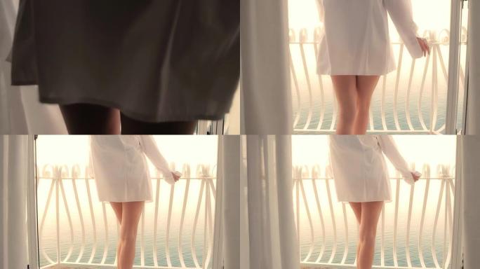 高清多莉: 女人在日出时走在阳台上
