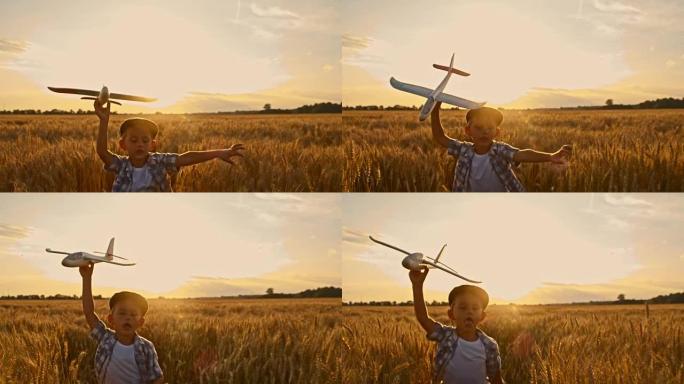 SLO MO可爱的男孩在野外与飞机玩具一起跑步