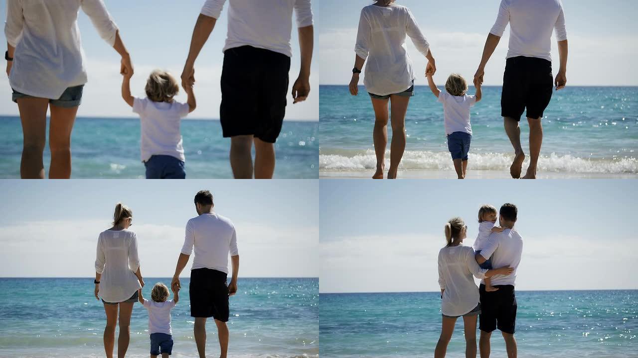 海滩上的家人呵护儿童成长一家三口旅游