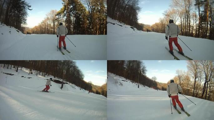 HD慢速运动：在滑雪板后面沿着滑雪坡滑雪