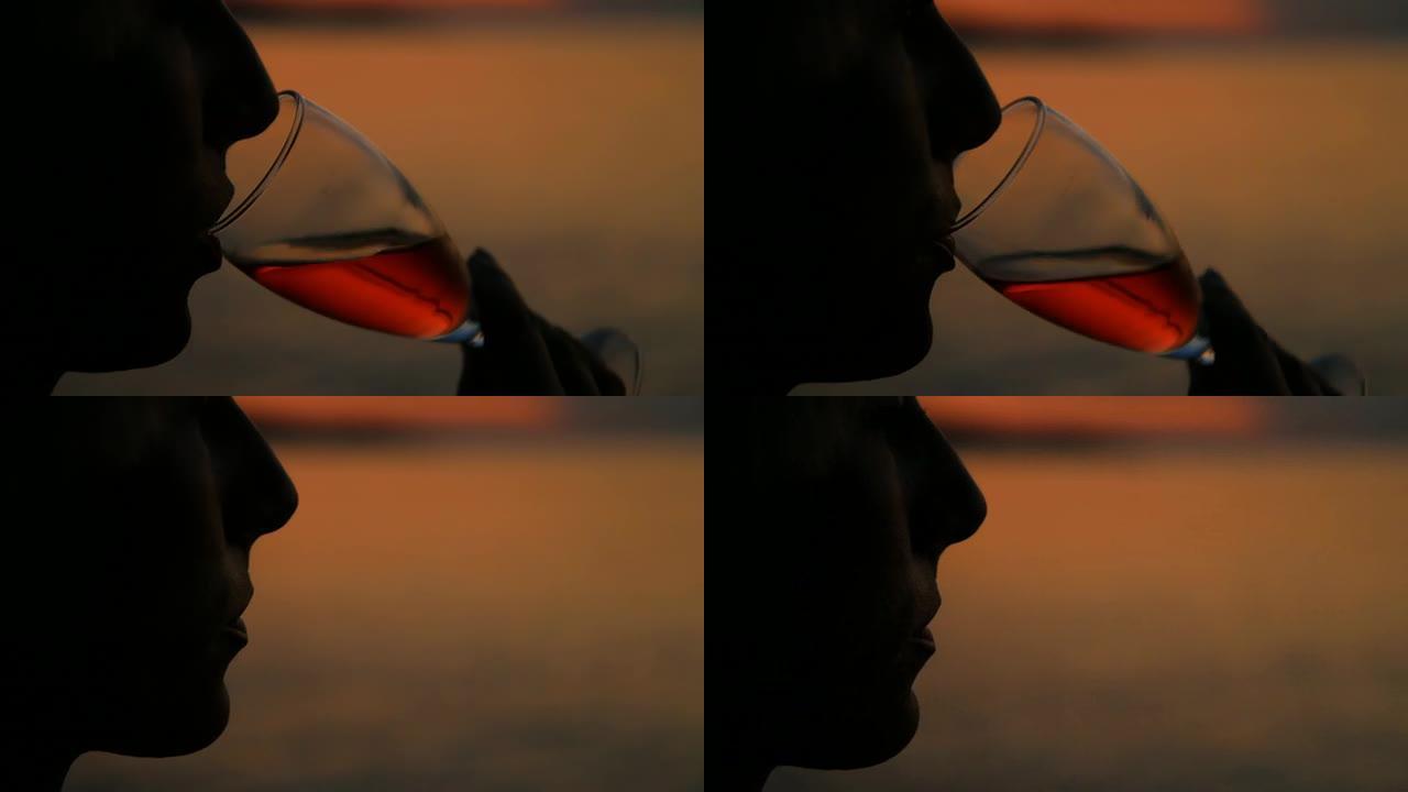 HD：黄昏时在海滩上喝酒的女人