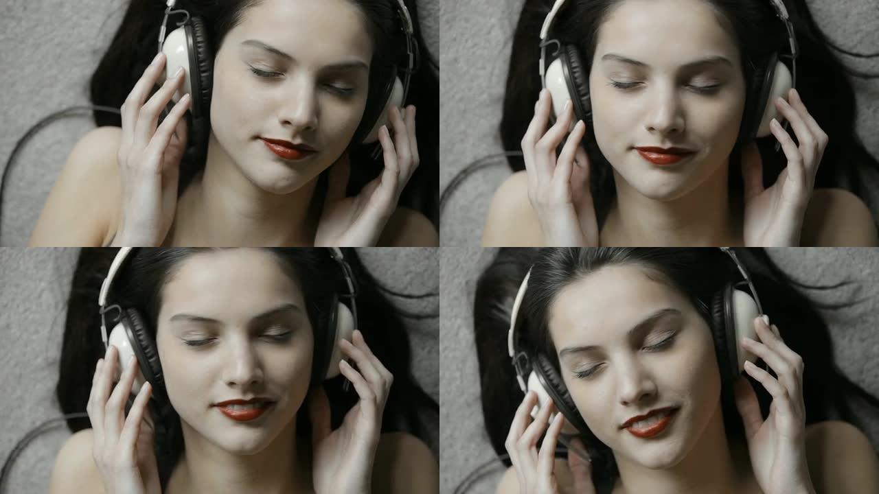 音乐女孩MU地板躺着耳机头戴耳机听歌