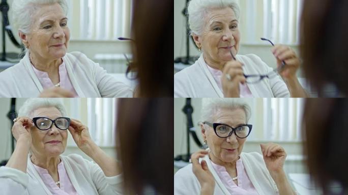 与女性眼科医生一起选择眼镜的老太太