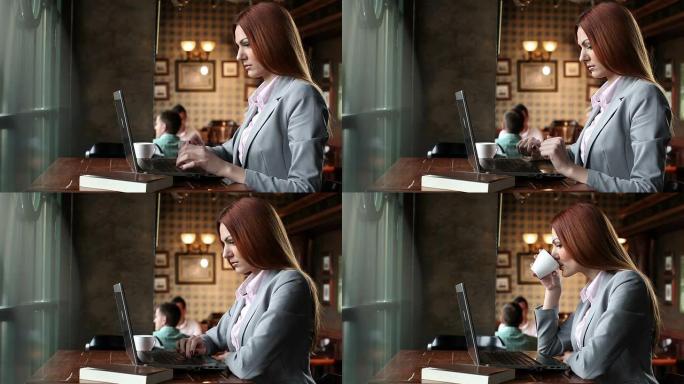 女人在咖啡店里使用笔记本电脑