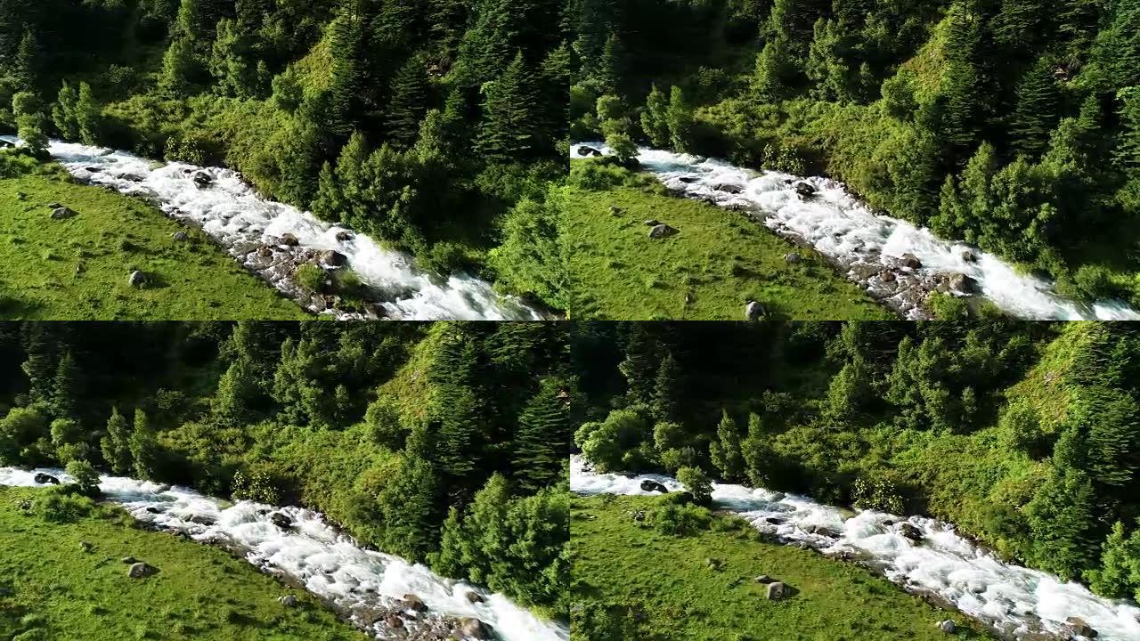 无人机在山上的溪流上方飞行