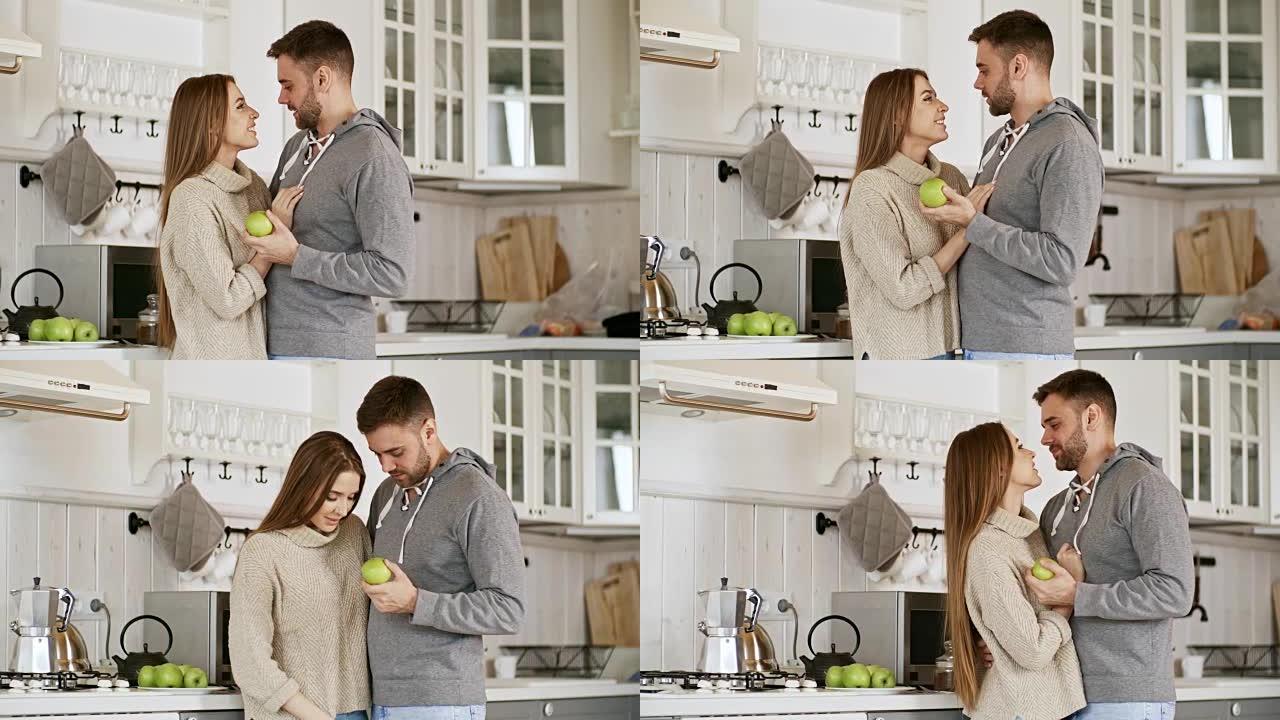 幸福的夫妻在厨房拥抱