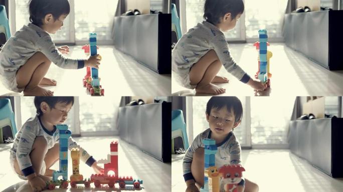 玩玩具车的男婴。纸尿裤宝宝
