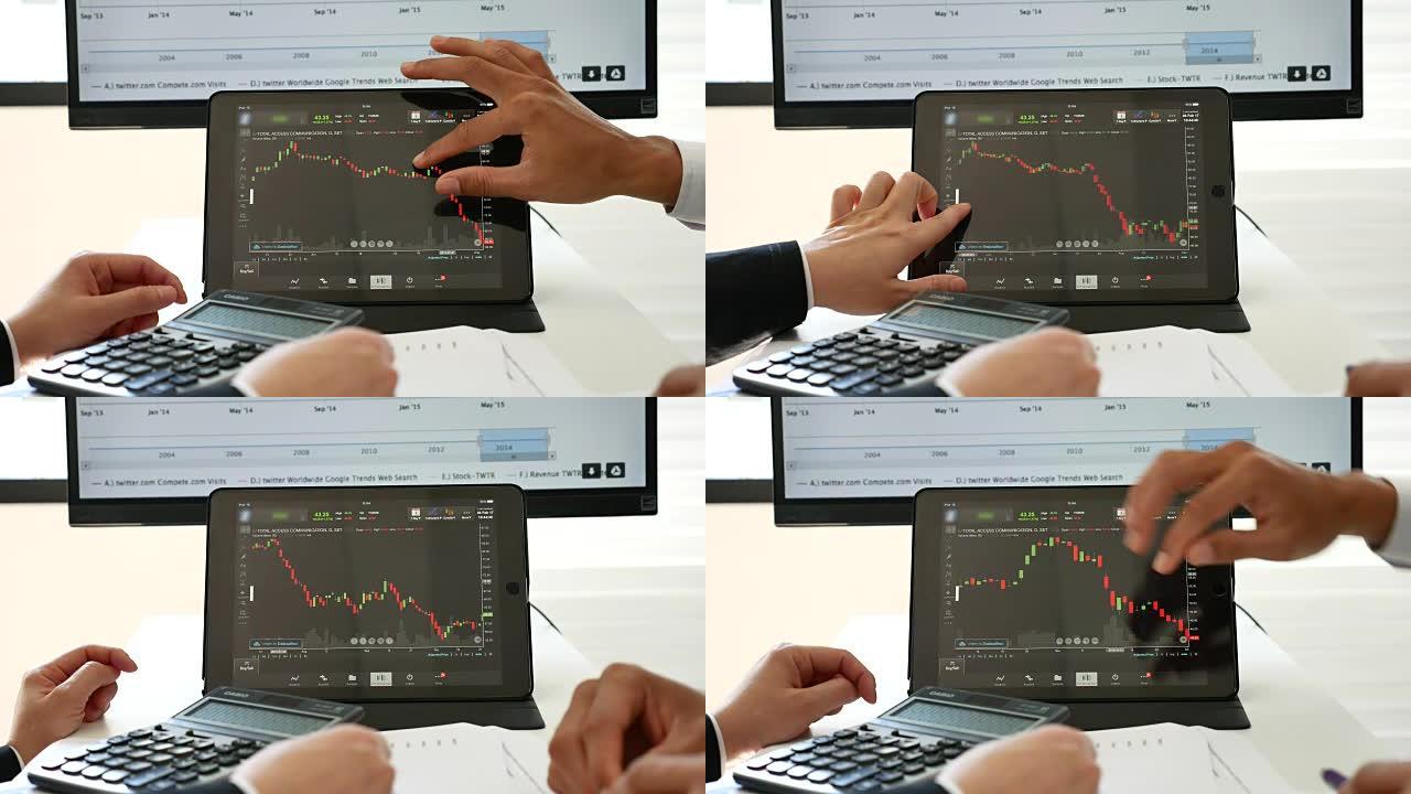 两名商务人士使用平板电脑分析股市数据