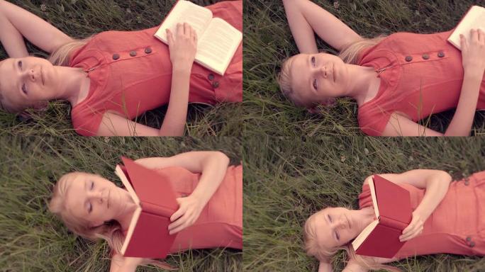躺在草地上看书的女人。