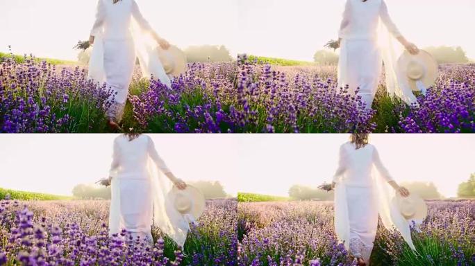 穿着白色连衣裙的女人走在薰衣草的田野里