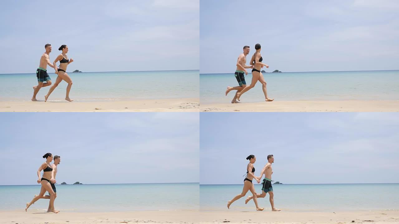 夫妇在海滩上奔跑周末时光旅游消费海边度假