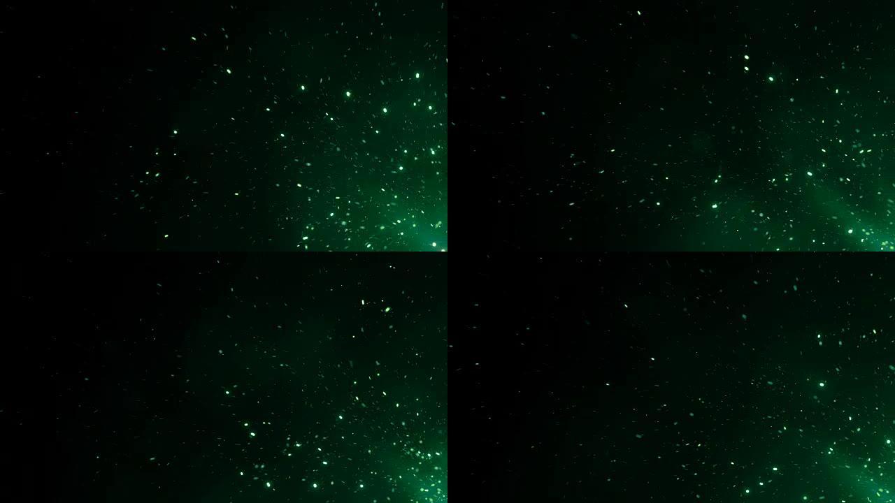 美丽的魔法火花从夜空的大火中升起。抽象孤立的绿色发光粒子在黑色背景上飞起来。循环3d动画。移动角落。