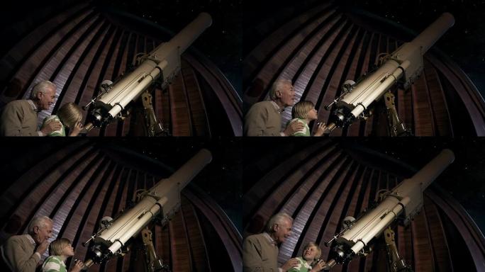 祖父和孙子用望远镜