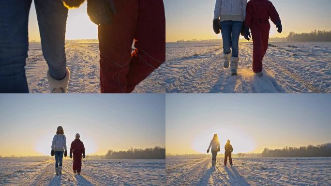 远景：母亲和女儿在雪地里行走