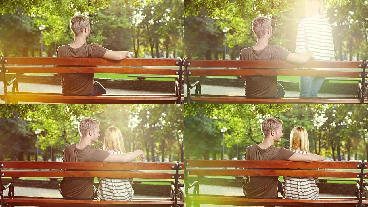 坐在长凳上的年轻夫妇