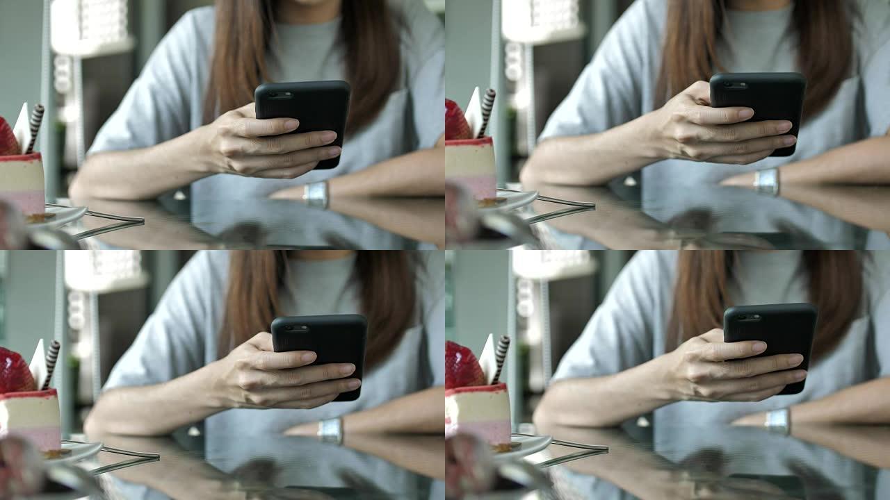 在咖啡馆使用智能手机的特写女人