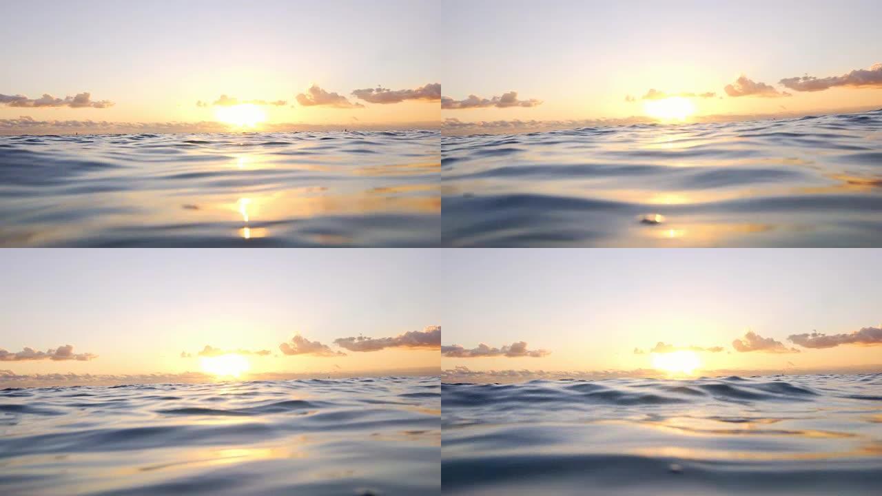 在海洋中放松时欣赏日落