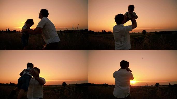 SLO MO父亲在日落时与儿子玩耍