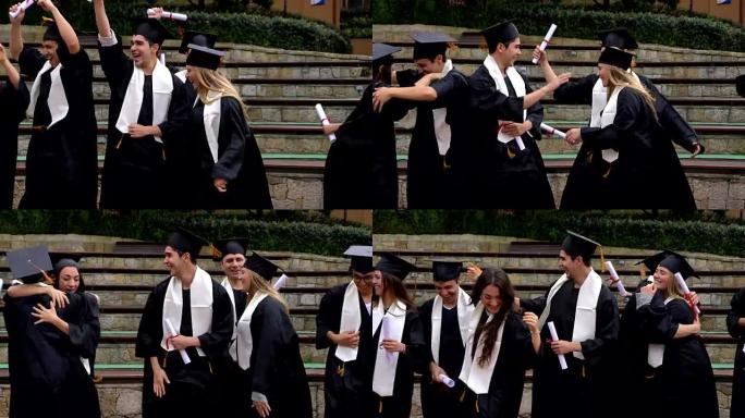 一群学生跳着拥抱庆祝他们刚从大学毕业