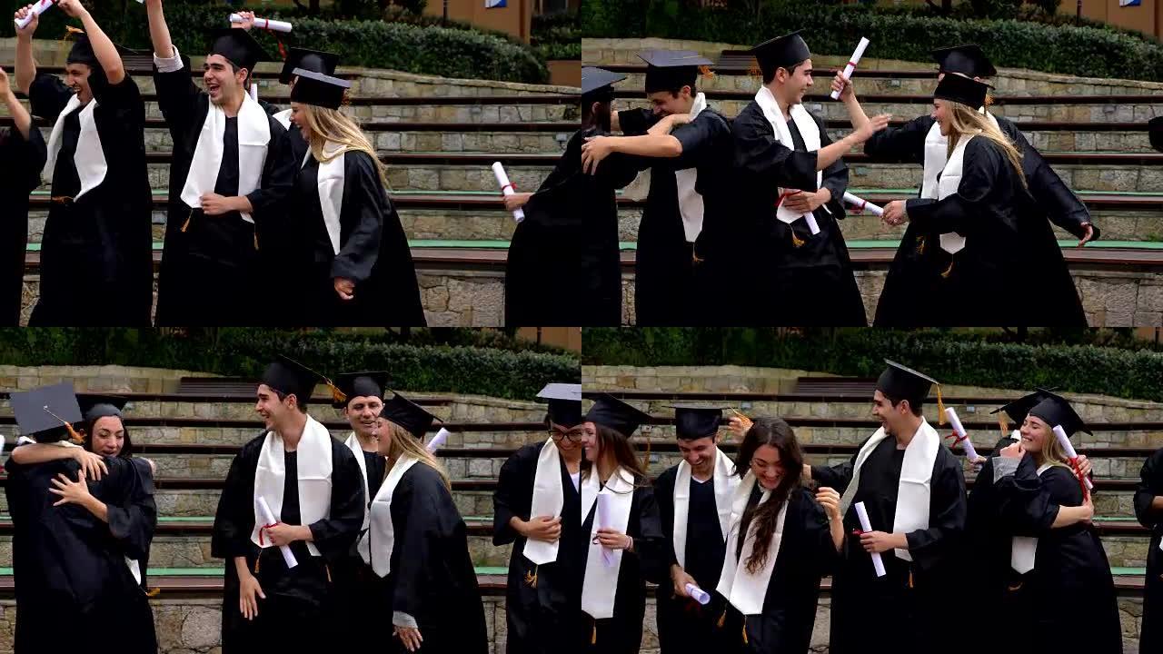 一群学生跳着拥抱庆祝他们刚从大学毕业