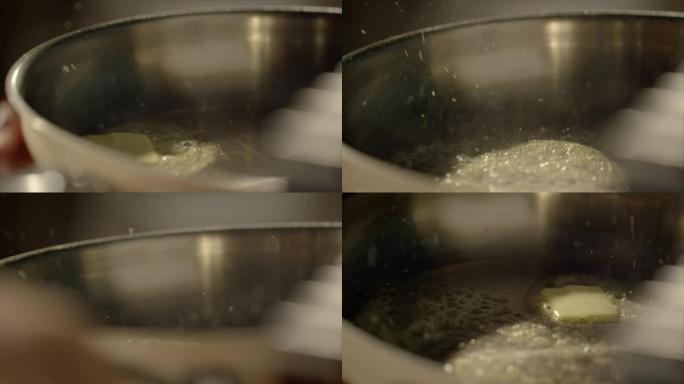 黄油在热锅中融化做饭