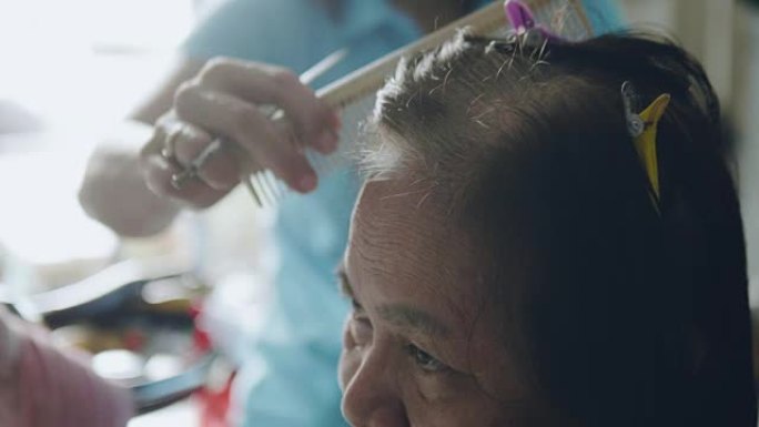 专业美发师，资深亚洲女性在沙龙理发和造型