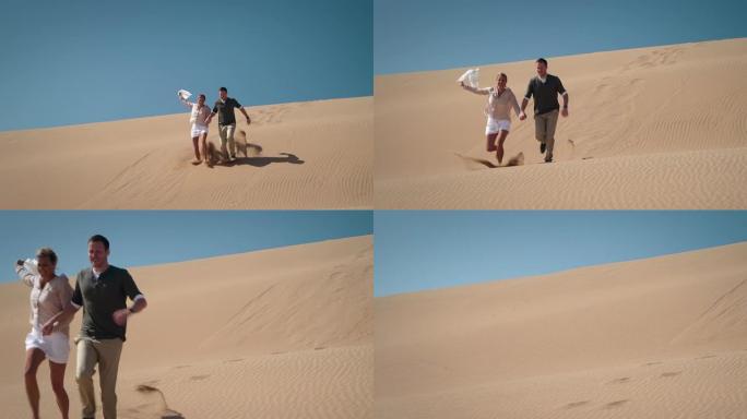 沙漠中的情侣老外奔跑游玩