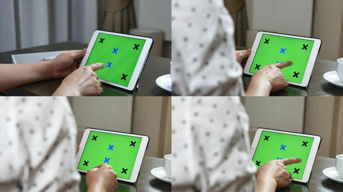 多莉用绿屏显示的平板电脑拍摄女人，色度键