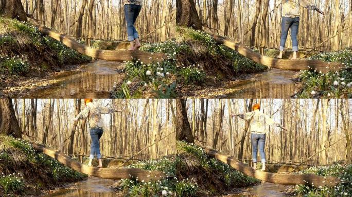 DS女人在春天的森林里穿过一条小溪