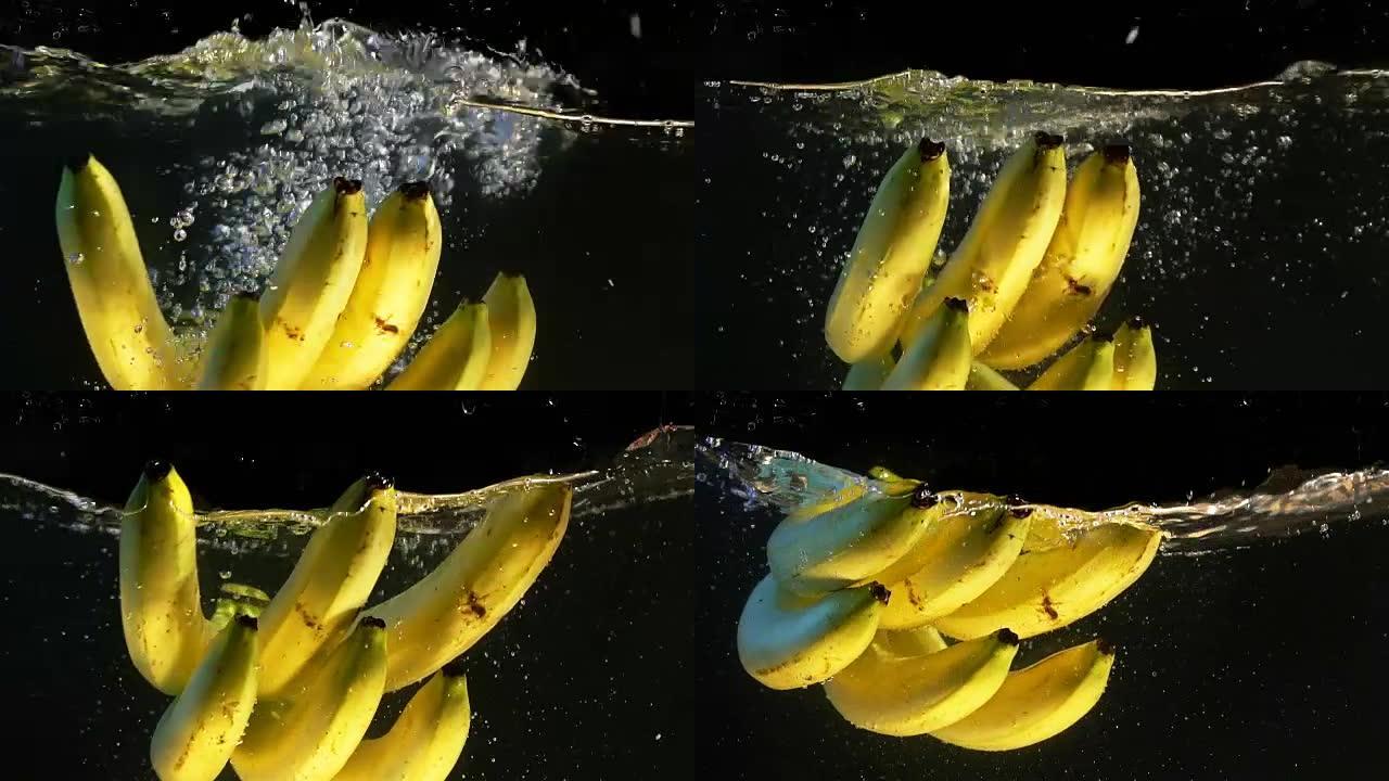 黄色柠檬。落水的水果。黑色背景。慢动作